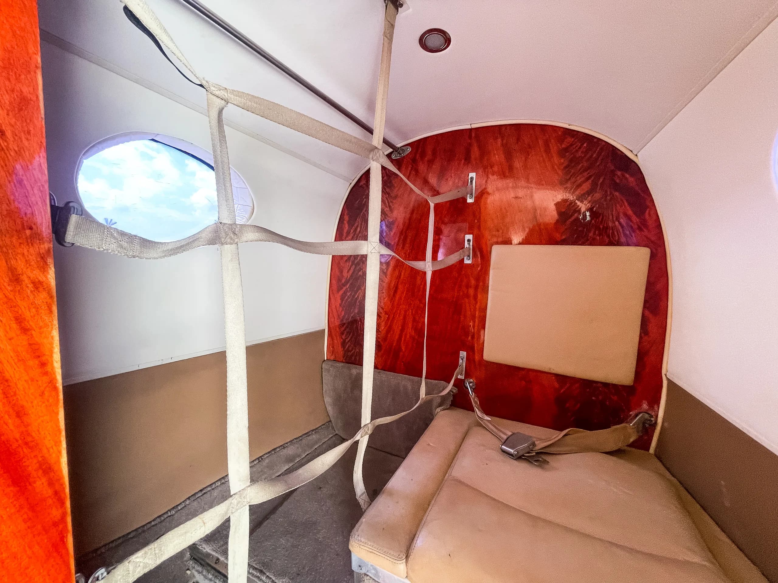 The interior of the aircraft is shown with cargo netting.