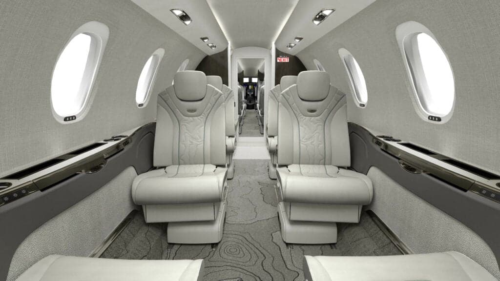 View of the aircraft's interior with white leather seats.