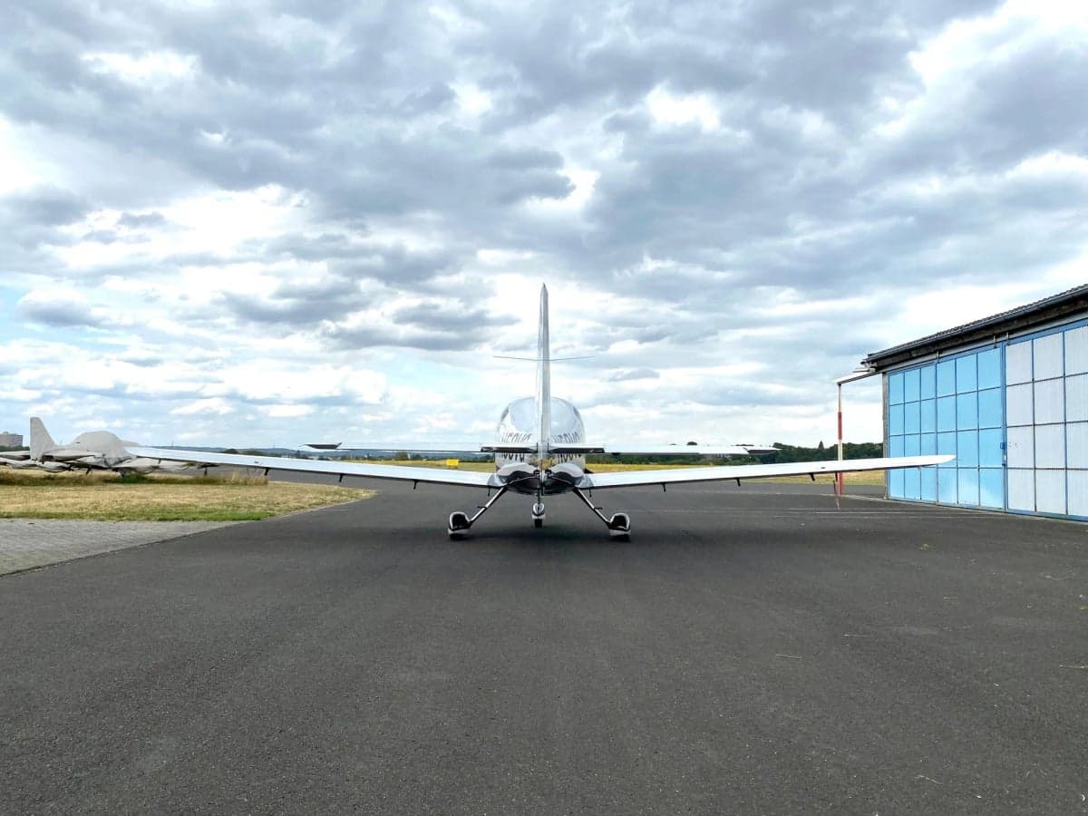 Rear view of Columbia 400 aircraft N58VG on the tarmac.
