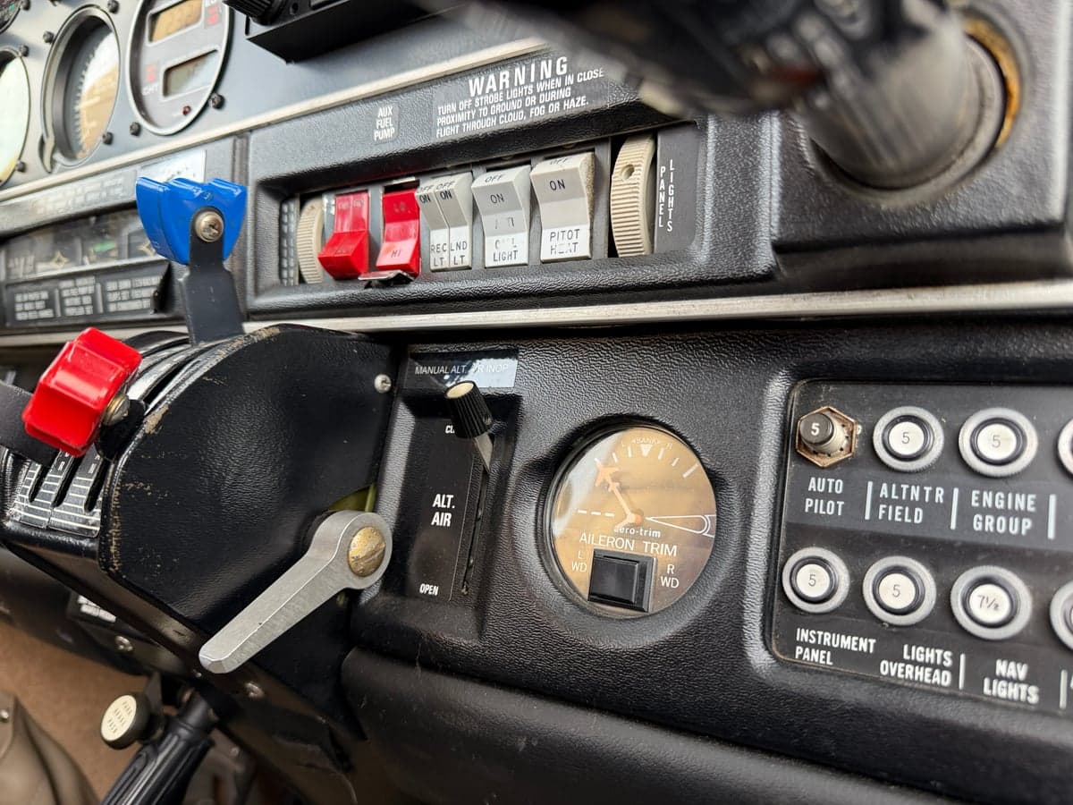 Close-up of the throttle controls and switches in the cockpit.