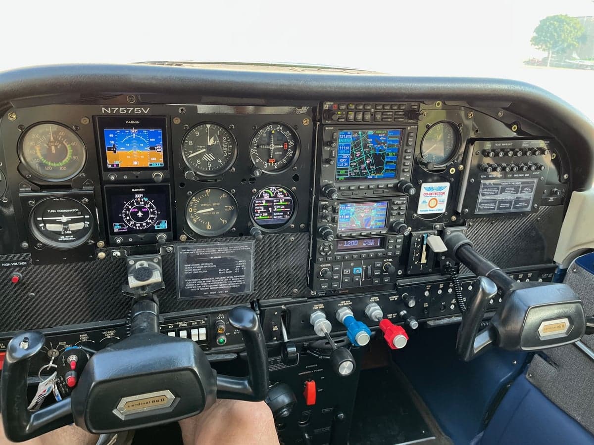 The cockpit of a Cessna Cardinal RG, featuring a modern instrument panel with multiple displays.