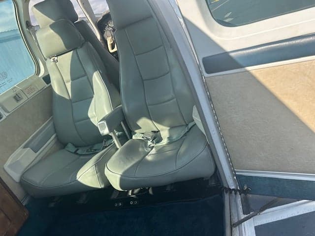 Interior view of the aircraft cabin, showing the seats.