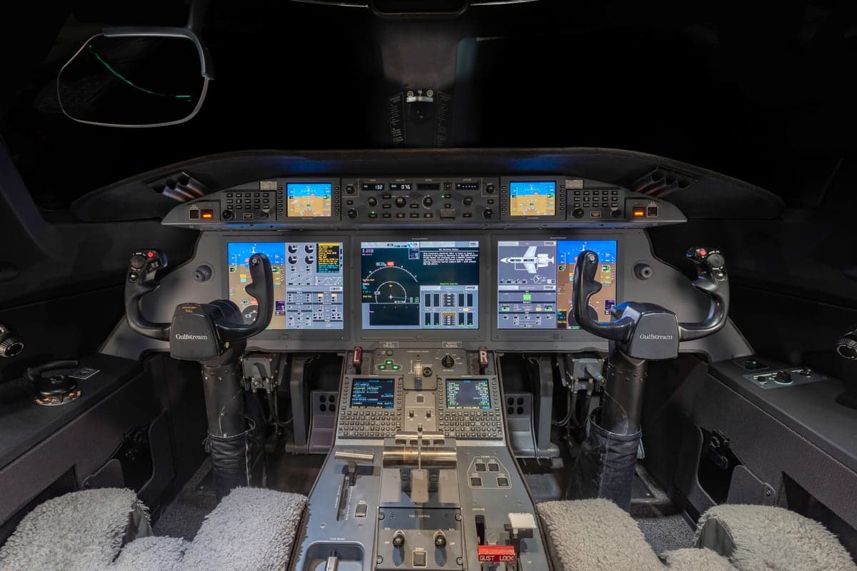View of the instrument panel and controls in the cockpit of a Gulfstream jet.