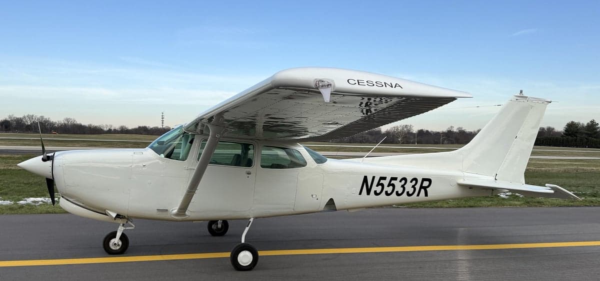 A Cessna 172 aircraft with tail number N5533R parked on the tarmac.