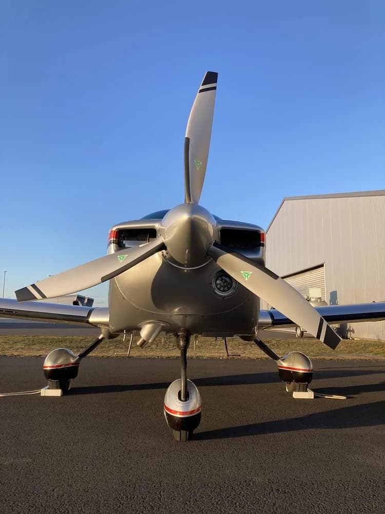 A head-on view of the Grumman American AA-5B Tiger aircraft, N267MT, highlighting its propeller and nose landing gear.