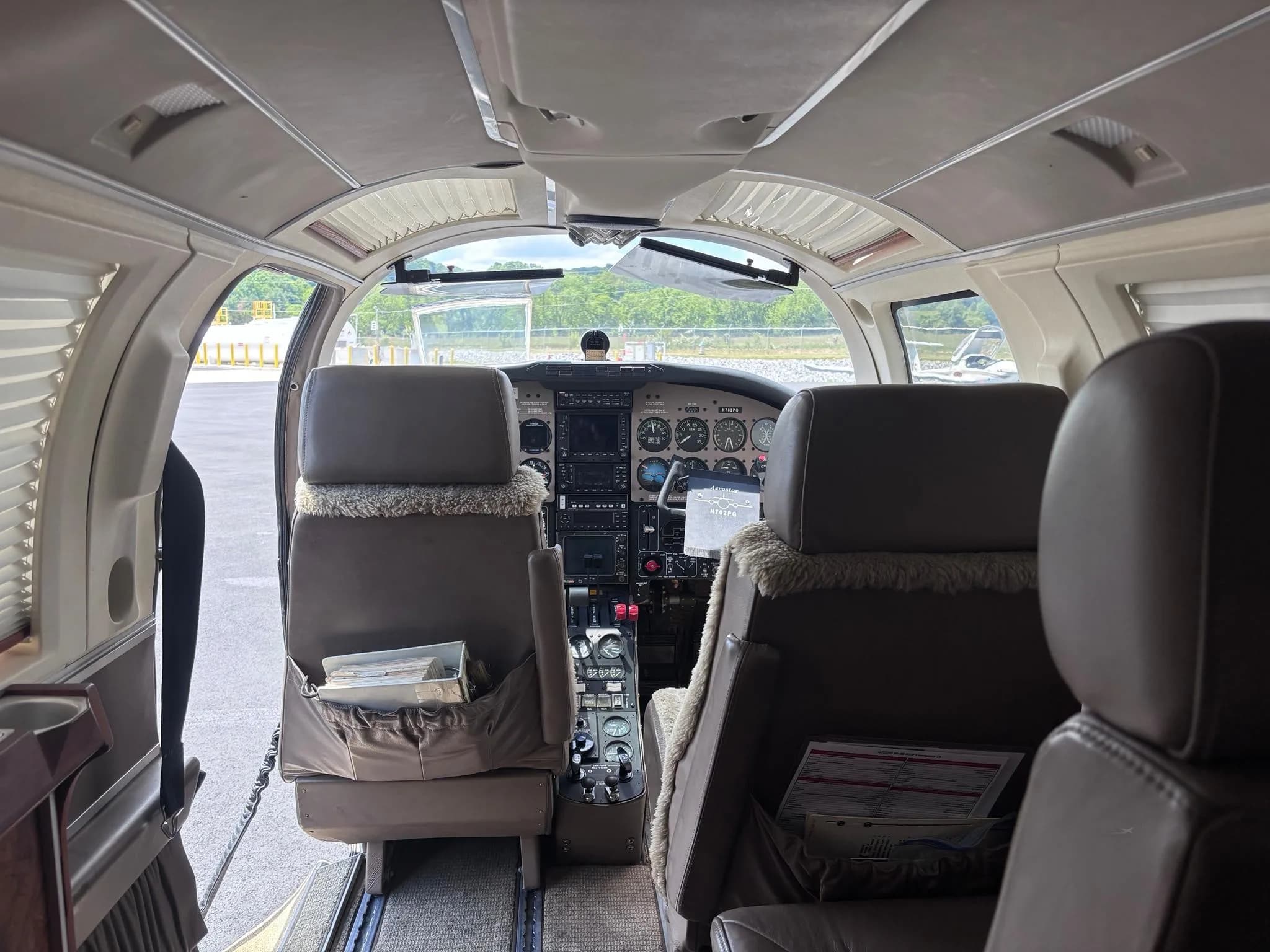 View from the cabin looking forward into the cockpit of the Aerostar aircraft.