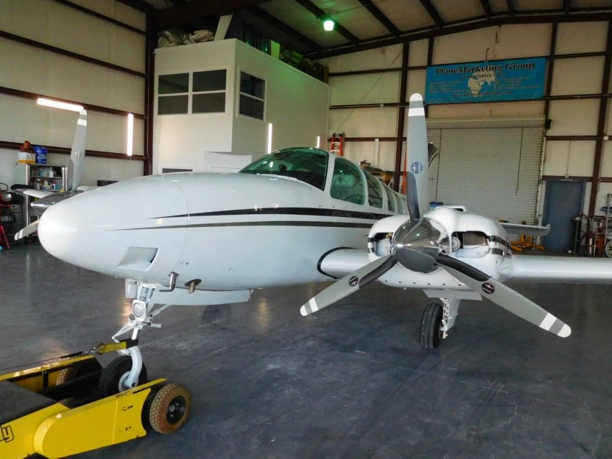 Front view of the Beechcraft Baron in a hangar.