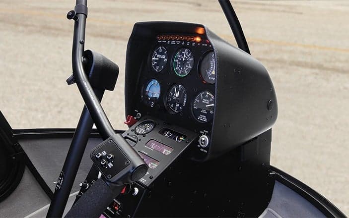 Close-up of the instrument panel in a Robinson R22 helicopter.