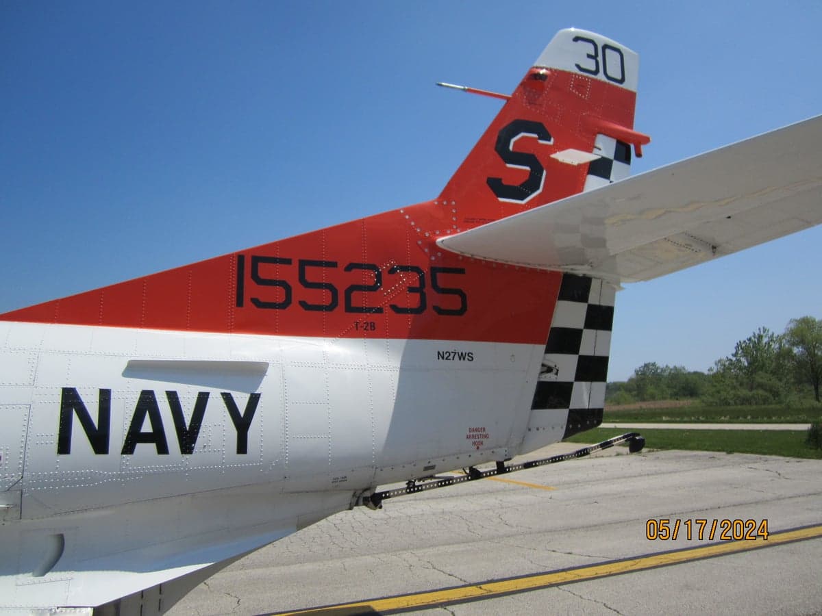 Tail section of the T-2B Buckeye aircraft with Navy markings.