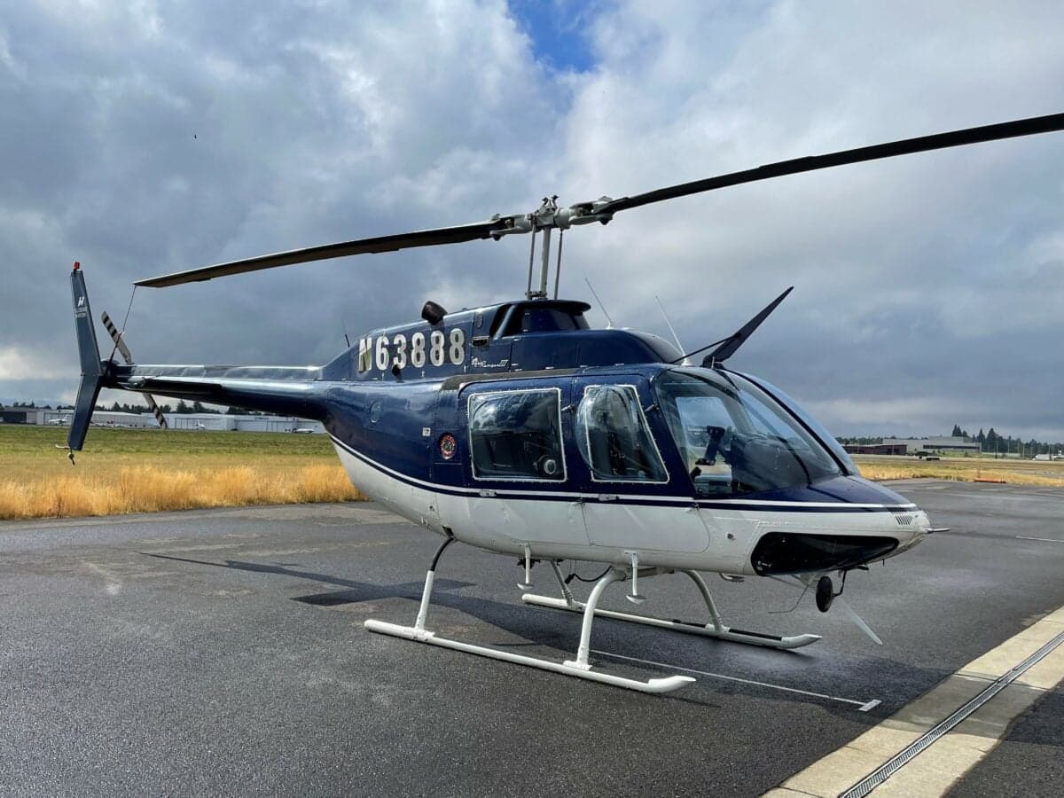 N63888 helicopter parked on the tarmac with a blue and white paint scheme.