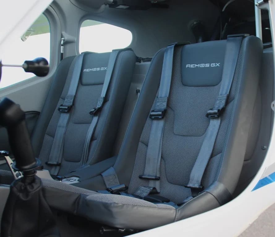 Interior view of the REMOS GX cockpit with gray seats.