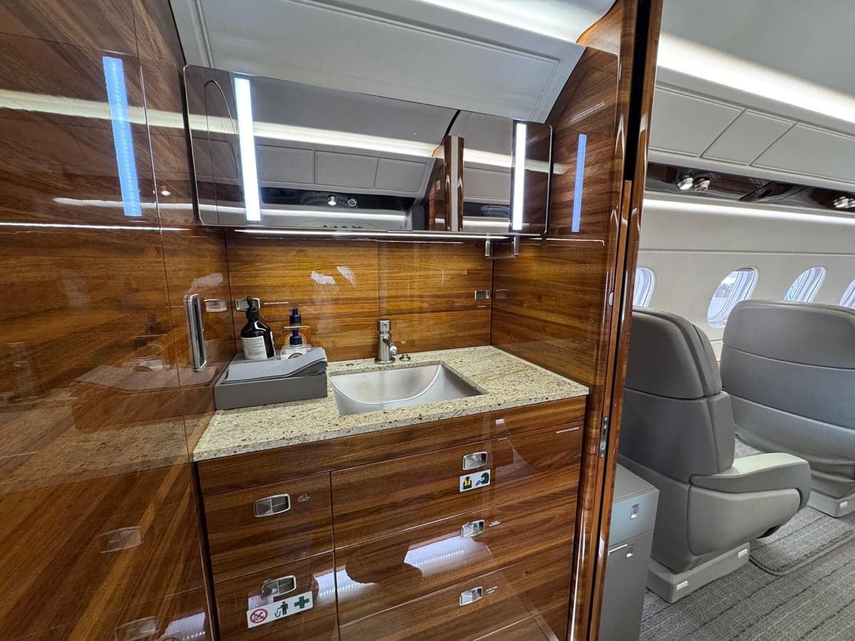 View of the aircraft's lavatory and cabin seats.