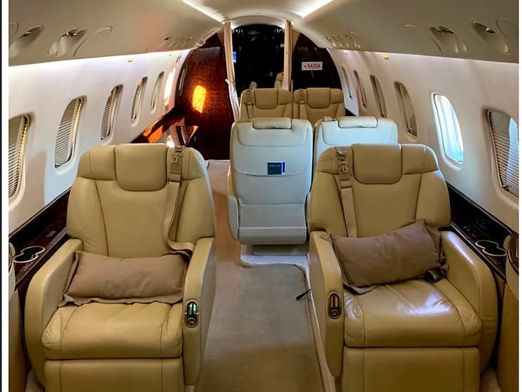 Full view of the interior of the aircraft featuring leather seats.