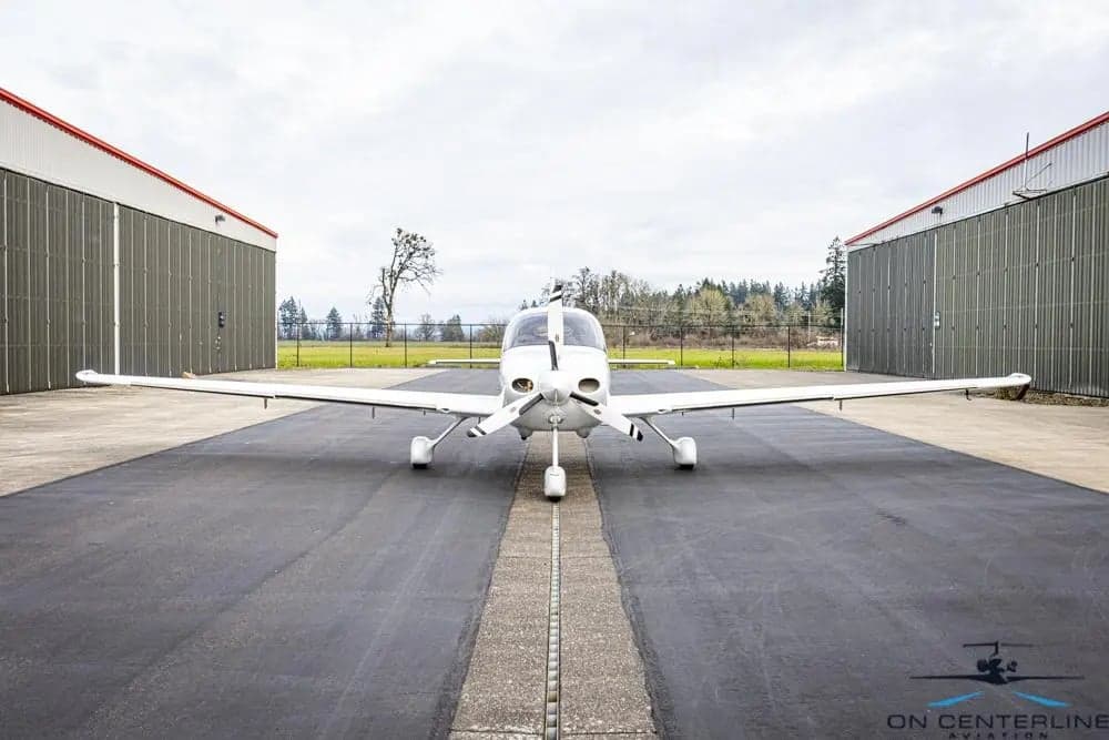 Front view of Cirrus SR22T aircraft N282CD parked on the tarmac.