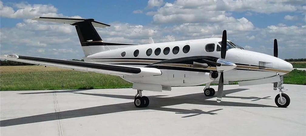 Side view of the King Air aircraft on the tarmac.