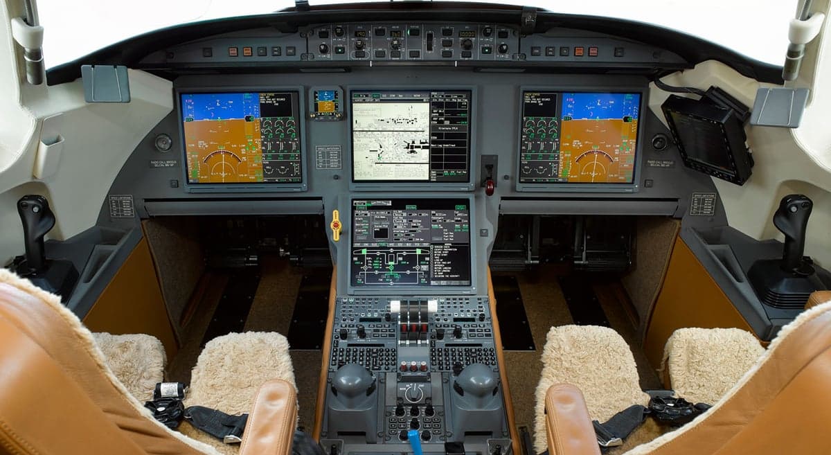 Full view of the aircraft's cockpit instrument panel and seating.