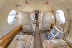 The cockpit of a Cessna Citation CJ1+ aircraft, showing the instrument panel and controls.