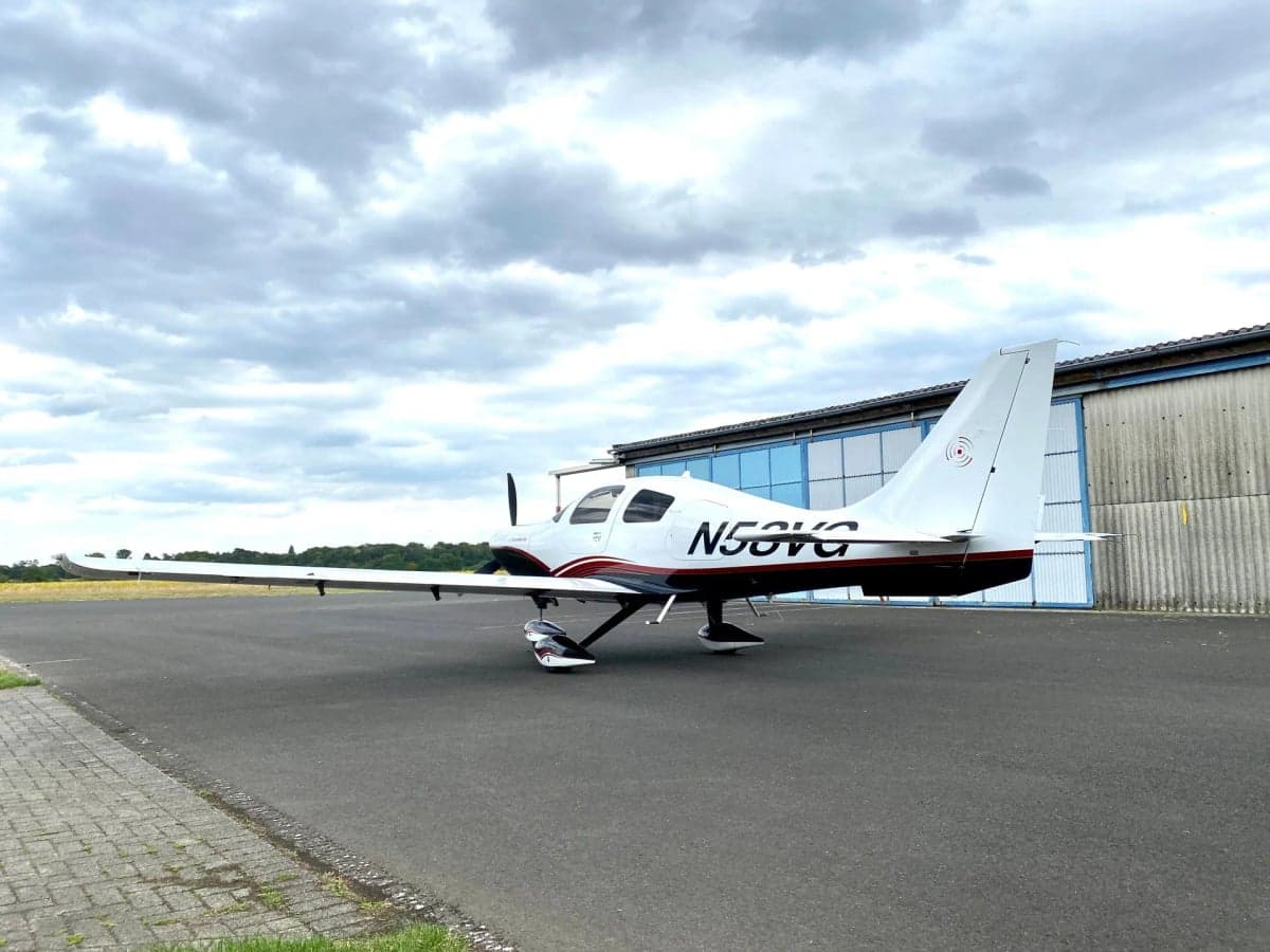 Side view of Columbia 400 aircraft N58VG parked on the tarmac.