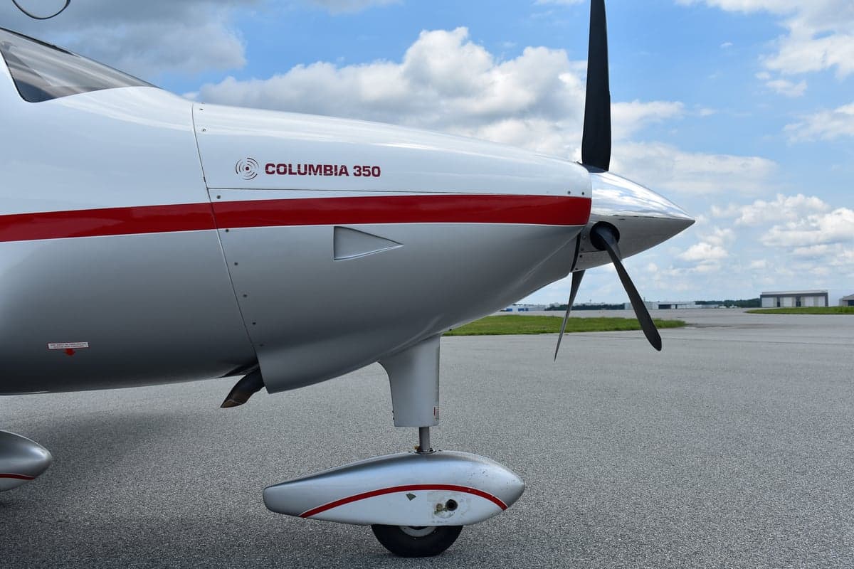 Front view of Columbia 350 aircraft N1137A with open doors.