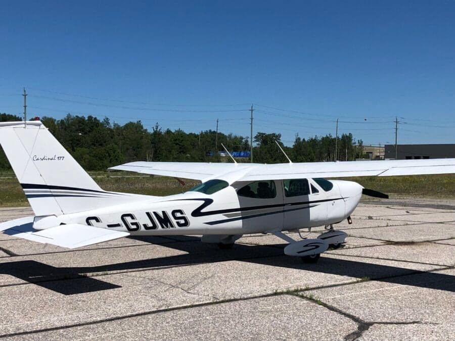 C-GJMS Cessna Cardinal 177 parked on cracked tarmac.