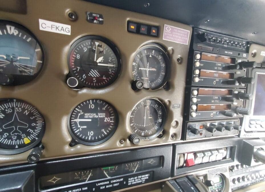 Close-up of the aircraft's instrument panel, showing various gauges and controls.