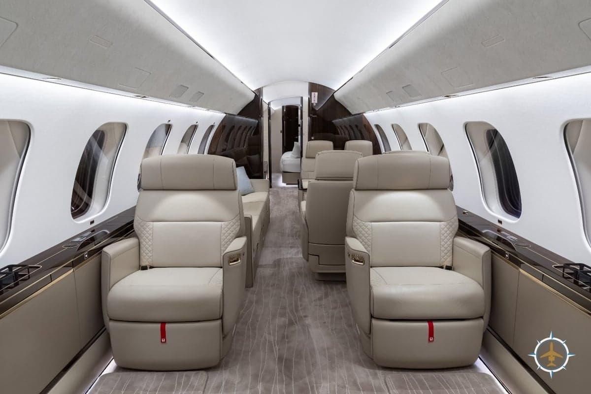 The interior of a Bombardier Global Express aircraft features luxurious seating and amenities.