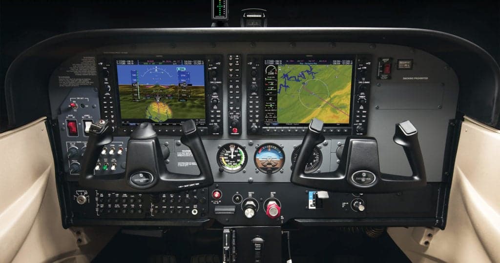 Detailed view of the aircraft's instrument panel with modern avionics.