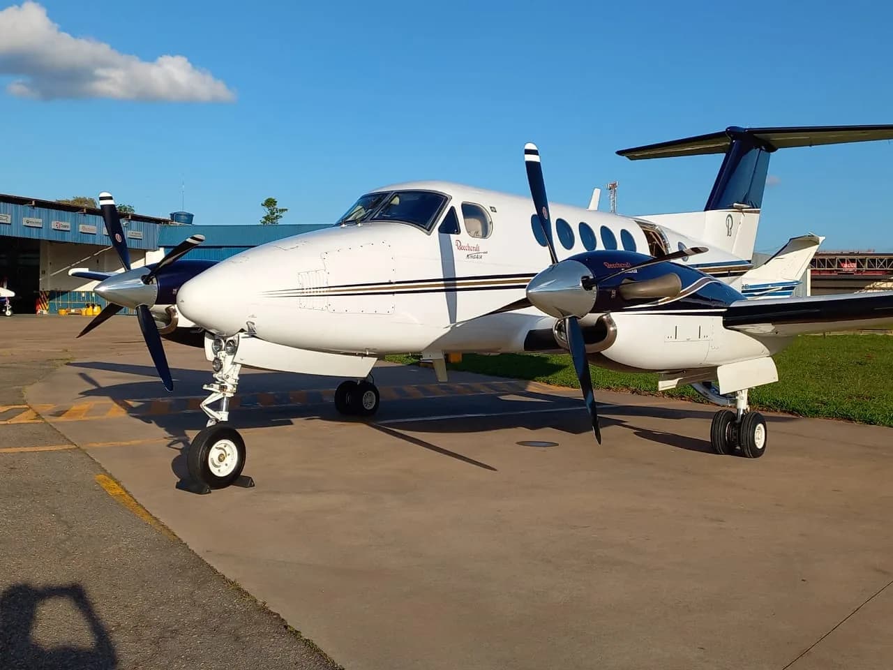 Side view of a Beechcraft King Air 200 on the tarmac.