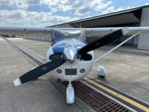 Front view of the Cessna 172 Skyhawk, registration N759CB, showing the propeller and nose.