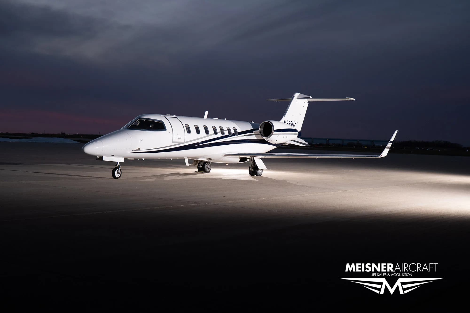 Learjet 45XR N289NX on the tarmac at dusk.