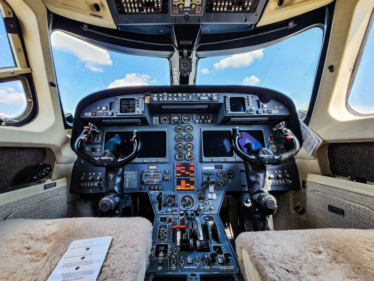 Aircraft lavatory with sink and seat.