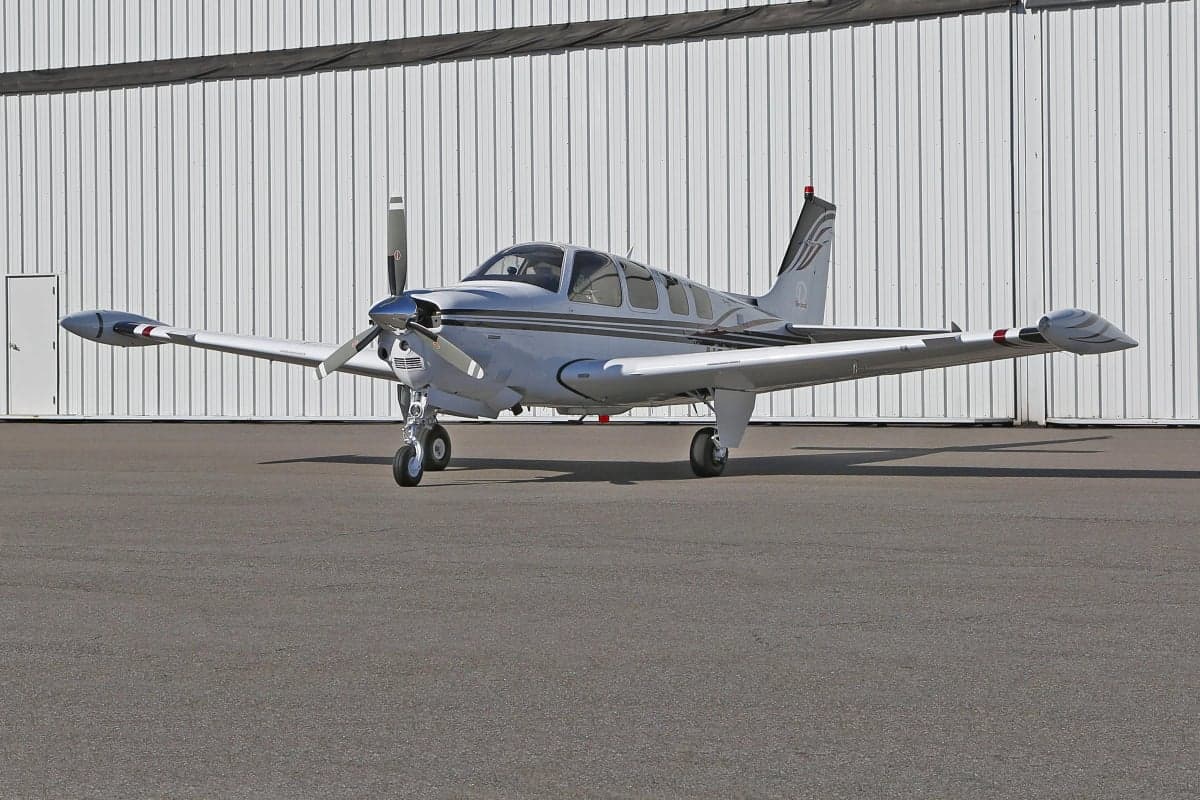 Side view of a Beechcraft Bonanza on the tarmac.