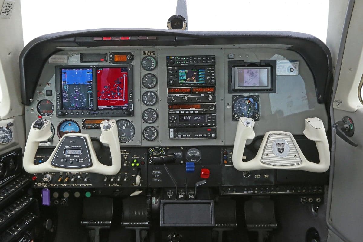 Detailed view of the aircraft's instrument panel and control yokes.