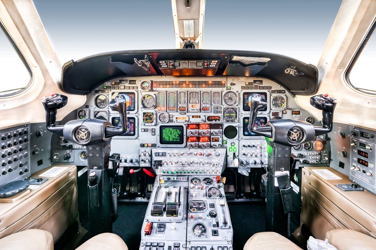 The cockpit of the aircraft features a full instrument panel and control yokes.