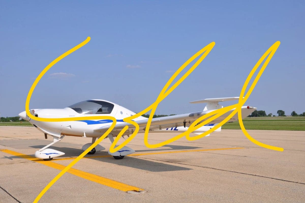 A Diamond DA40 aircraft on the tarmac with a blue and white paint scheme.