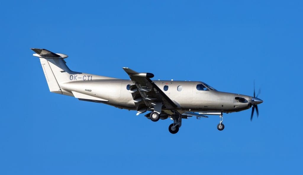 Pilatus PC-12 aircraft with registration OK-CTI in flight.