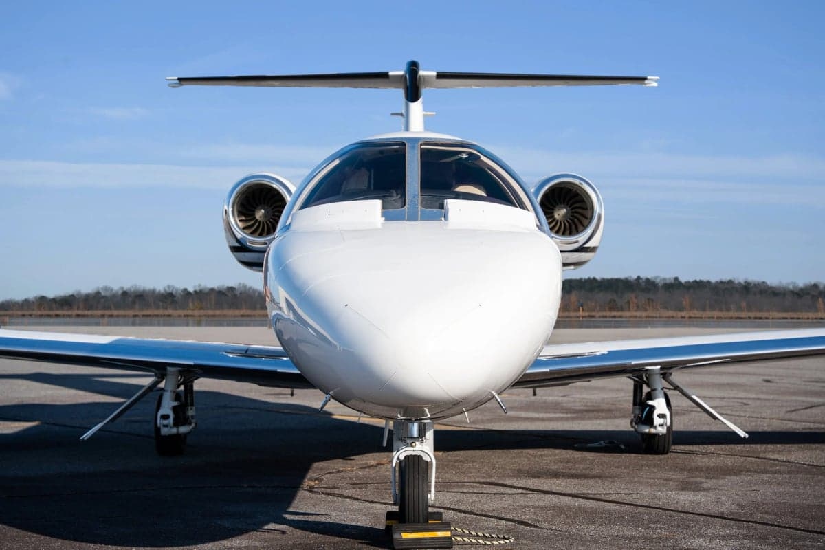 Front view of the aircraft showing the nose and engines.