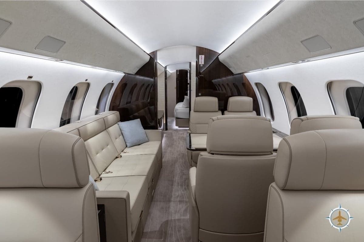 The interior of a Bombardier Global Express aircraft features luxurious seating and amenities.