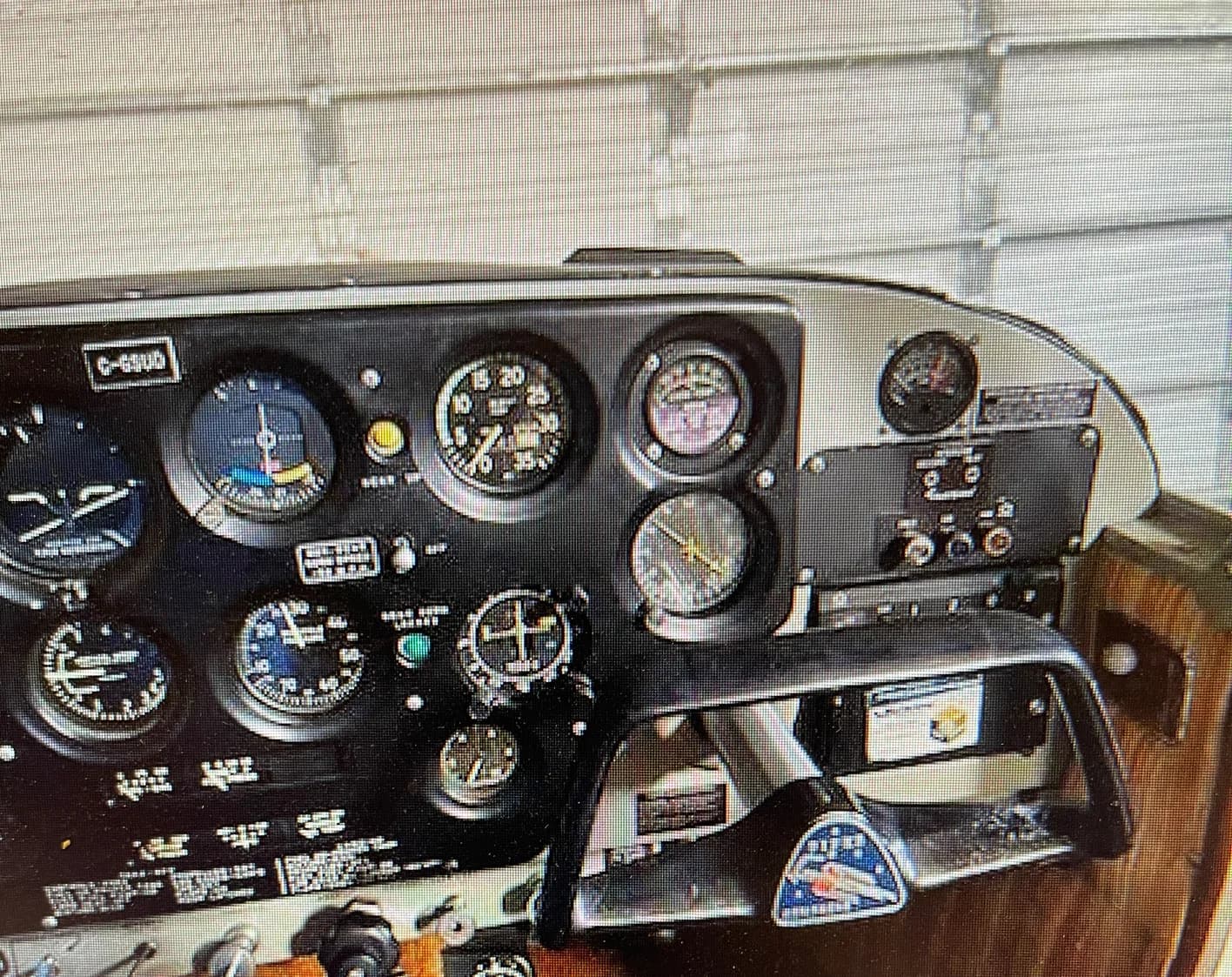 Close-up of the aircraft's instrument panel, showing various gauges and controls.
