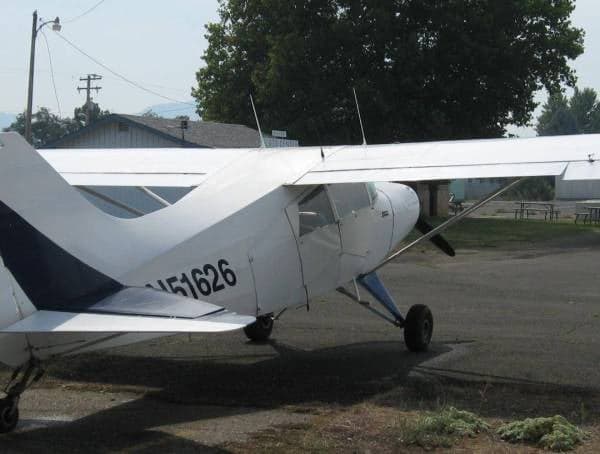 A white and blue Maule M-5-235C, registration N51626, parked on the tarmac.