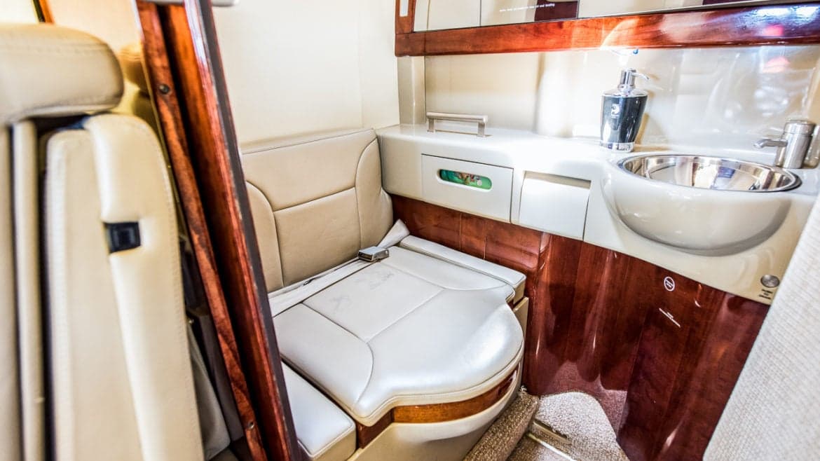 Aircraft lavatory with toilet and sink.