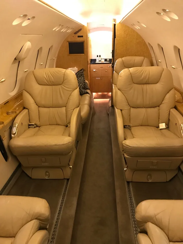View of the aircraft's interior with tan leather seats.