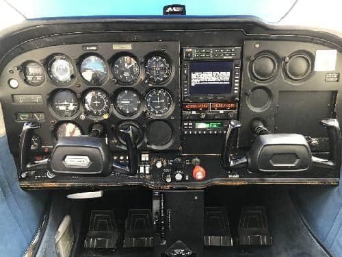 The cockpit of the aircraft features a full instrument panel and control yokes.