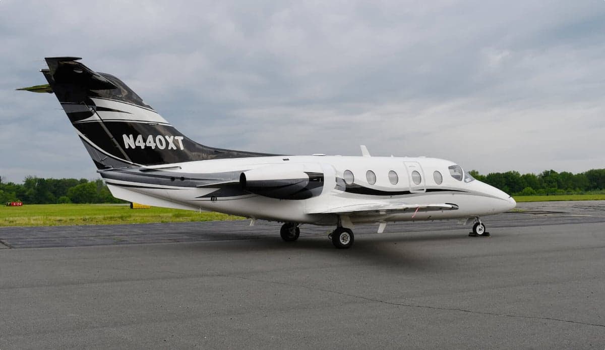 Side view of the N440XT jet on the tarmac.