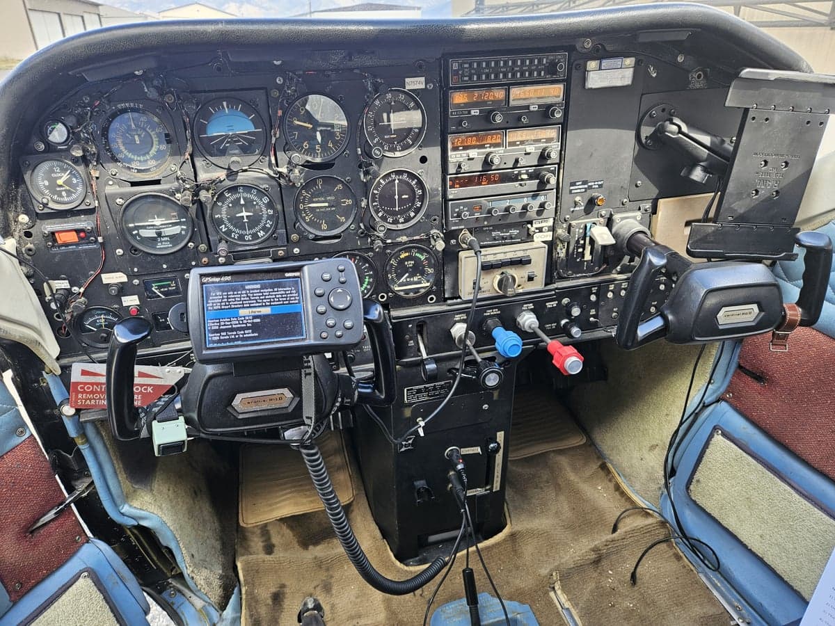 The cockpit of a Cessna 182 Skylane, showing the instrument panel and controls.