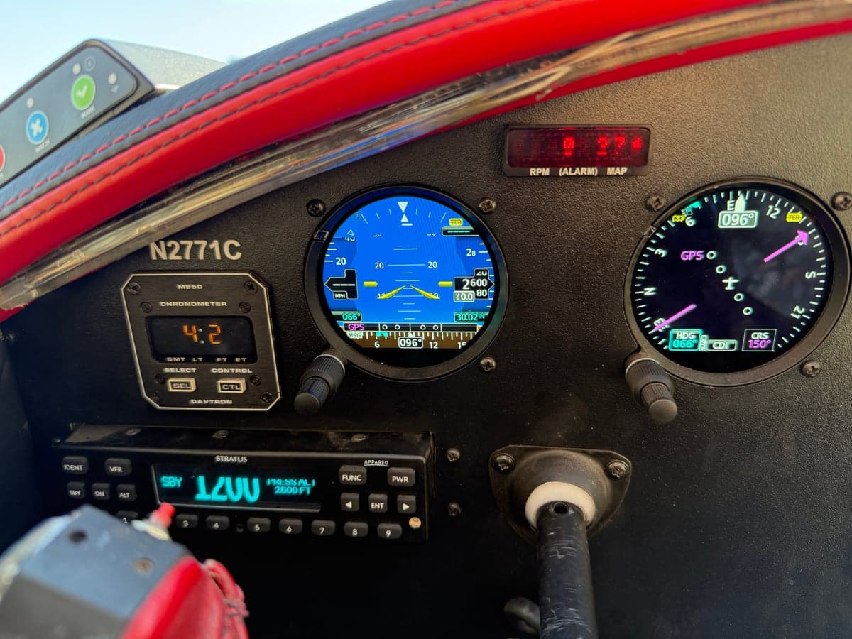 Close-up of the aircraft's instrument panel, showing various gauges and controls.