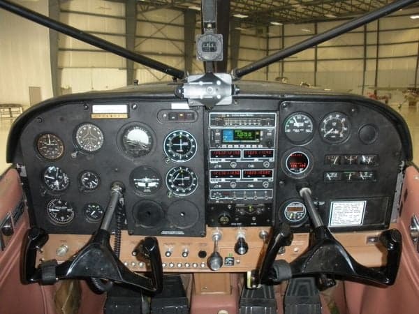 Detailed view of the Cessna Skywagon 180's instrument panel and controls.