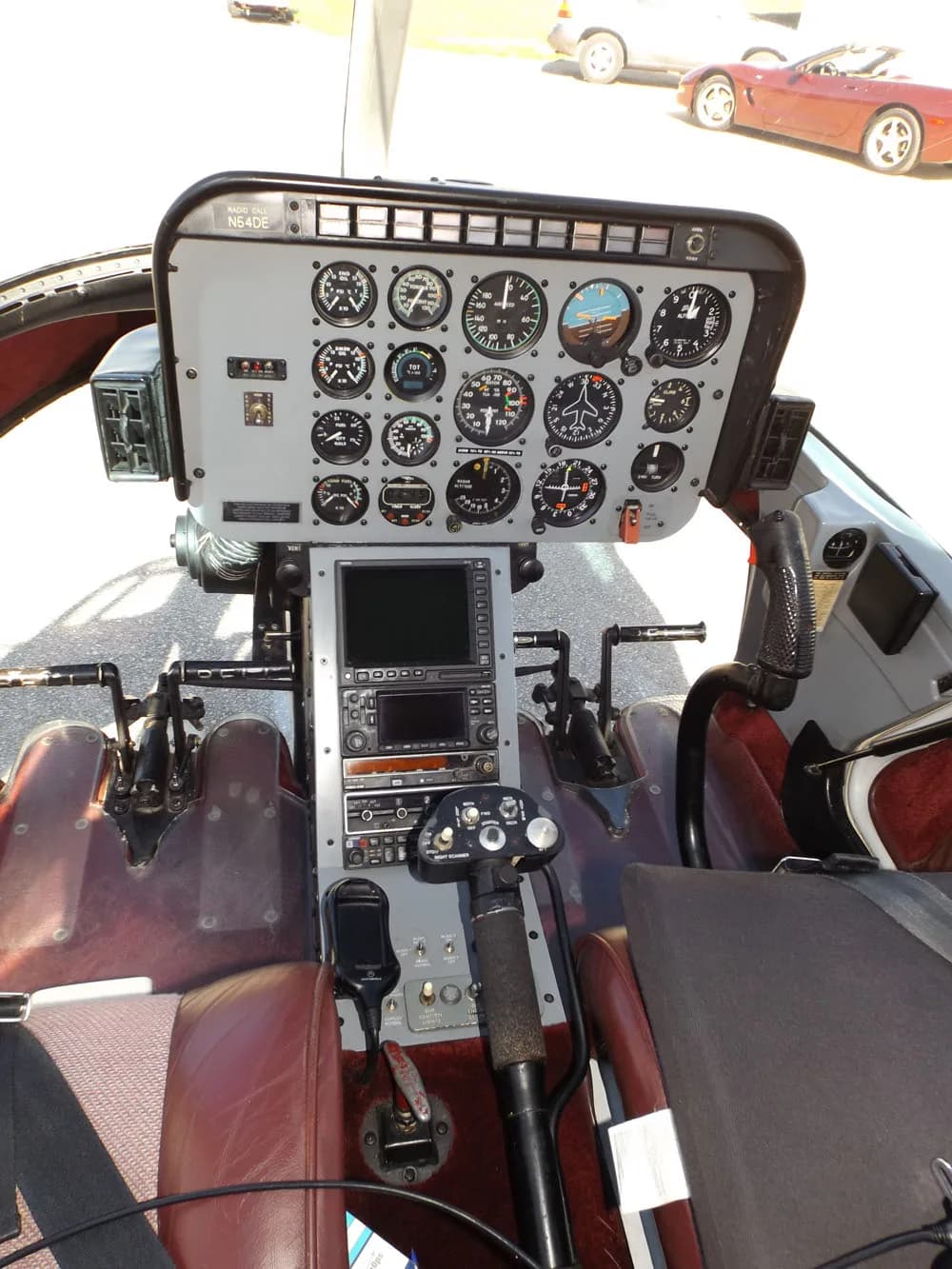 The cockpit of the Bell 206B JetRanger III shows the instrument panel and controls.