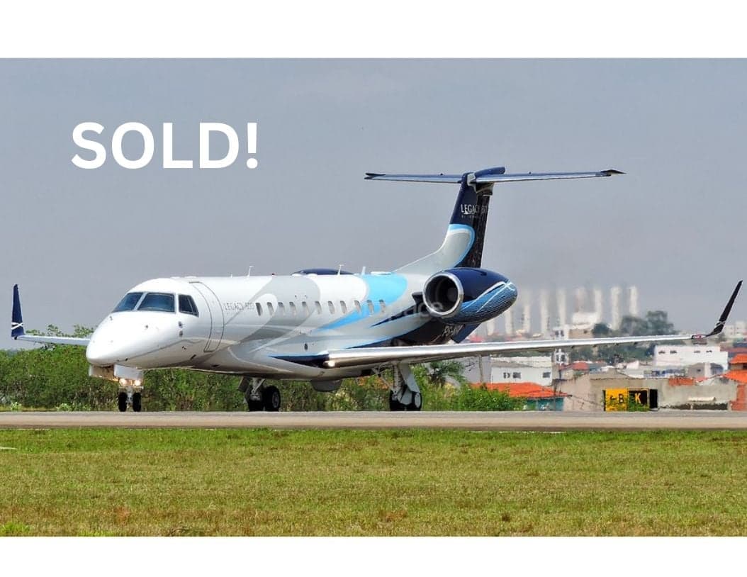 A Legacy 650 aircraft is shown on the runway with a SOLD overlay.