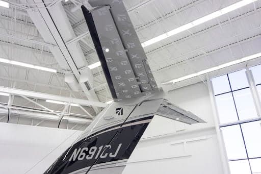 A close-up view of the tail section of the Cessna Citation CJ3+ aircraft, showing the N691CJ registration and the vertical stabilizer.